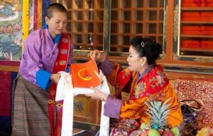 Dr. Zangmo presents the new training framework, Nuns Empowerment Through Capacity and Skills Development, to Her Majesty the Queen Mother Ashi Tshering Yangdoen Wangchuck. Image courtesy of the BNF